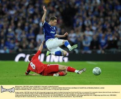 Football - Carling Cup Final - Cardiff City vs. Liverpool FC - Liverpool s Steven Gerrard fouls Joe Mason of Cardiff City at Wembley Stadium, London 