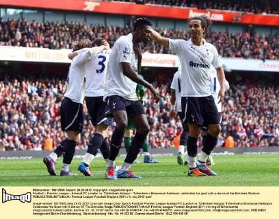 Football - Premier League - Arsenal FC London vs. Tottenham Hotspur - Tottenham s Emmanuel Adebayor celebrates his goal with a dance at the Emirates Stadium