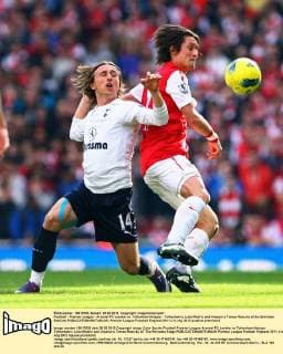 Football - Premier League - Arsenal FC London vs. Tottenham Hotspur - Tottenham s Luka Modric and Arsenal s Tomas Rosicky at the Emirates Stadium 