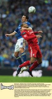 Don Cowie of Cardiff City gets to grips with Glen Johnson of Liverpool during the Cardiff City vs Liverpool FC during the Carling Cup Final, London..26th February, 2012. EDITORIAL USE ONLY. No use with unauthorised audio, video, data, fixture lists, club league logos or live services. Online in-match use limited to 120 images, no video emulation. No use in betting, games or single club league player publications. PC 01