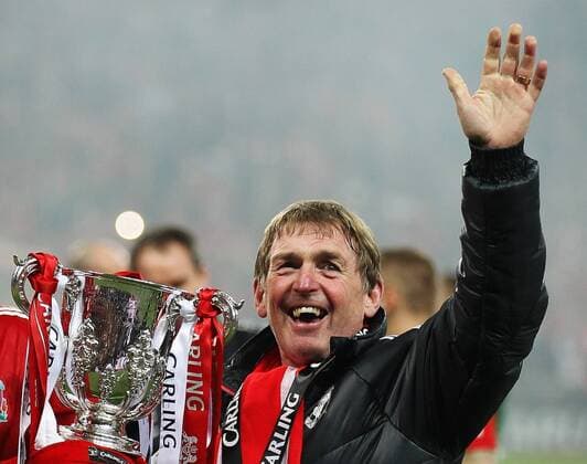 Kenny Dalglish manger of Liverpool holds the Carling Cup..Cardiff City v Liverpool during the Carling Cup Final, London..26th February, 2012. EDITORIAL USE ONLY. No use with unauthorised audio, video, data, fixture lists, club league logos or live services. Online in-match use limited to 120 images, no video emulation. No use in betting, games or single club league player publications. PC 01