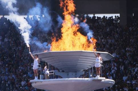 Seoul Olympics - Opening Ceremony with Chong Son Man, Son Mijong and Kim Won Tak - 17 09 1988 The lighting of the flame with the Olympic touches. This was the last time Doves were released at the Opening Ceremony, after many of them were killed by the flame on being lit. 