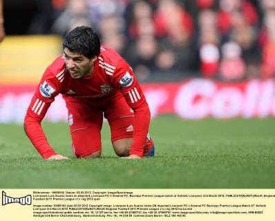 Liverpools Luis Suarez looks on dejected..Liverpool FC V Arsenal FC, Barclays Premier League match at Anfield, Liverpool. 3rd March 2012. EDITORIAL USE ONLY. No use with unauthorised audio, video, data, fixture lists, club league logos or live services. Online in-match use limited to 120 images, no video emulation. No use in betting, games or single club league player publications.