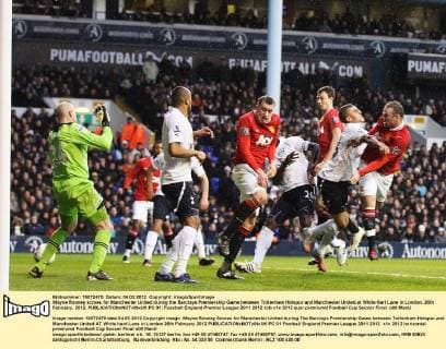 Wayne Rooney scores for Manchester United during the Barclays Premiership Game between Tottenham Hotspur and Manchester United,at White Hart Lane in London..26th February, 2012. EDITORIAL USE ONLY. No use with unauthorised audio, video, data, fixture lists, club league logos or live services. Online in-match use limited to 120 images, no video emulation. No use in betting, games or single club league player publications. PC 01