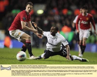 Danny Rose of Tottenham Hotspur gets tackled by Johhny Evans of Manchester United during the Barclays Premiership Game between Tottenham Hotspur and Manchester United,at White Hart Lane in London, 2012. EDITORIAL USE ONLY. No use with unauthorised audio, video, data, fixture lists, club league logos or live services. Online in-match use limited to 120 images, no video emulation. No use in betting, games or single club league player publications. PC 01