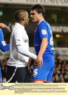 Tottenham Hotspur - FC Stevenage Borough, Jermaine Defoe - Tottenham and Ronnie Henry- Stevenage sguare up to each other 