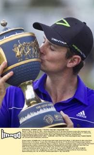 March 11, 2012 - Doral, FL, USA - Justin Rose gives a kiss to the Gene Sarasson trophy after winning by one stroke at the World Golf Championships Cadillac Championship tournament on Sunday March 11, 2012 at the Doral Golf Resort & Spa in Doral, Florida. World Golf Championships Cadillac Championship - ZUMAm67