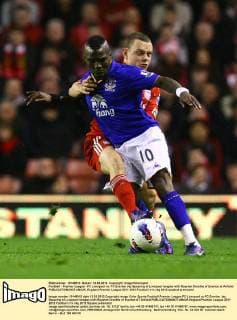 Football - Premier League - FC Liverpool vs. FC Everton Jay Spearing of Liverpool tangles with Royston Drenthe of Everton at Anfield 