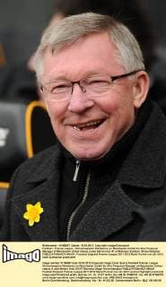 Football - Premier league - Wolverhampton Wanderers vs. Manchester United Sir Alex Ferguson Manager of Manchester United shares a joke before kick off at Molineux Stadium, Wolverhampton 