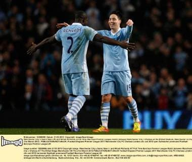 Manchester City s Samir Nasri (R) and Micah Richards at full time..Barclays Premier League match between Manchester City v Chelsea at the Etihad Stadium, Manchester on the 21st March 2012.. EDITORIAL USE ONLY. No use with unauthorised audio, video, data, fixture lists, club league logos or live services. Online in-match use limited to 120 images, no video emulation. No use in betting, games or single club league player publications.