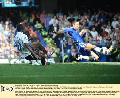 Football - Premier League - Chelsea FC London vs. Tottenham Hotspur Gary Cahill (Chelsea) saves a certain goal from the boot of Emmanuel Adebayor - Tottenham 