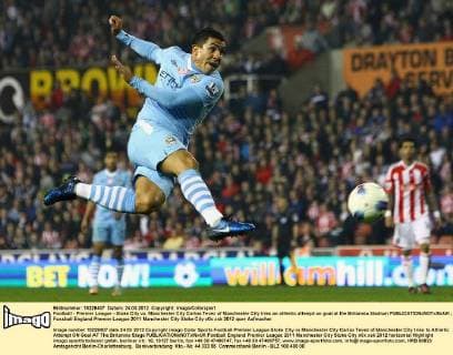 Football - Premier League - Stoke City vs. Manchester City Carlos Tevez of Manchester City tries an athletic attempt on goal at the Britannia Stadium 