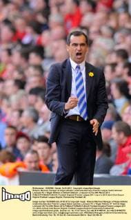 Roberto Martinez manager of Wigan Athletic celebrates Barclays Premier League match between Liverpool FC v Wigan Athletic at Anfield Stadium, Liverpool on the 24th March 2012 EDITORIAL USE ONLY. No use with unauthorised audio, video, data, fixture lists, club league logos or live services. Online in-match use limited to 120 images, no video emulation. No use in betting, games or single club league player publications.
