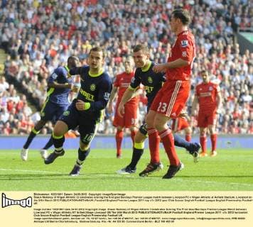 Shaun Maloney of Wigan Athletic (l) celebrates scoring the first goal Barclays Premier League match between Liverpool FC v Wigan Athletic at Anfield Stadium, Liverpool on the 24th March 2012 EDITORIAL USE ONLY. No use with unauthorised audio, video, data, fixture lists, club league logos or live services. Online in-match use limited to 120 images, no video emulation. No use in betting, games or single club league player publications.