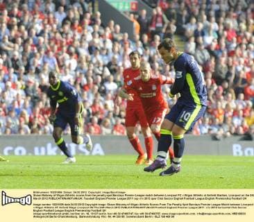 Shaun Maloney of Wigan Athletic scores from the penalty spot Barclays Premier League match between Liverpool FC v Wigan Athletic at Anfield Stadium, Liverpool on the 24th March 2012 EDITORIAL USE ONLY. No use with unauthorised audio, video, data, fixture lists, club league logos or live services. Online in-match use limited to 120 images, no video emulation. No use in betting, games or single club league player publications.