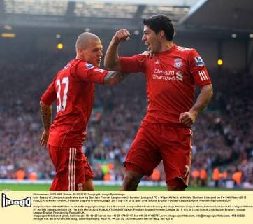 Luis Suarez of Liverpool celebrates scoring Barclays Premier League match between Liverpool FC v Wigan Athletic at Anfield Stadium, Liverpool on the 24th March 2012 EDITORIAL USE ONLY. No use with unauthorised audio, video, data, fixture lists, club league logos or live services. Online in-match use limited to 120 images, no video emulation. No use in betting, games or single club league player publications.