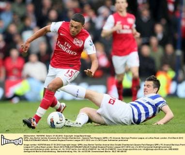 QPRs Joey Barton tackles Arsenals Alex Oxlade-Chamberlain - Queens Park Rangers (QPR) v FC Arsenal, Barclays Premier League, at Loftus Road, London. 31st March 2012 EDITORIAL USE ONLY. No use with unauthorised audio, video, data, fixture lists, club league logos or live services. Online in-match use limited to 120 images, no video emulation. No use in betting, games or single club league player publications.