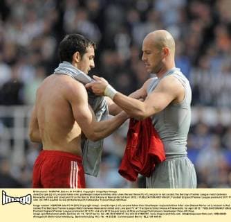 Jose Enrique (L) of Liverpool takes over goalkeeper responsibilities after Jose Manuel Reina (R) of Liverpool is red carded.The Barclays Premier League match between Newcastle United and Liverpool FC at the Sports Direct Arena at Newcastle 1st April 2012..r EDITORIAL USE ONLY. No use with unauthorised audio, video, data, fixture lists, club league logos or live services. Online in-match use limited to 120 images, no video emulation. No use in betting, games or single club league player publications.