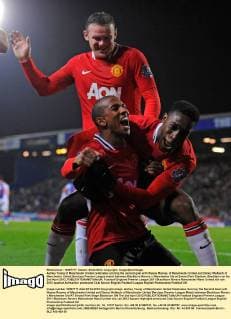 Ashley Young of Manchester United celebrates scoring the second goal with Wayne Rooney of Manchester United and Danny Welbeck of Manchester United.Barclays Premier League match between Blackburn Rovers v Manchester Utd at Ewood Park Stadium, Blackburn on the 2nd April 2012..EDITORIAL USE ONLY. No use with unauthorised audio, video, data, fixture lists, club league logos or live services. Online in-match use limited to 120 images, no video emulation. No use in betting, games or single club league player publications.