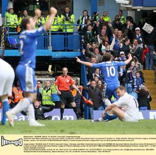 Chelseas Juan Mata celebrates scoring a late winner as assistant referee Dave Bryan looks on Chelsea FC London vs. Wigan Athletic, Barclays Premier League, at Stamford Bridge, London. 7th April 2012 EDITORIAL USE ONLY. No use with unauthorised audio, video, data, fixture lists, club league logos or live services. Online in-match use limited to 120 images, no video emulation. No use in betting, games or single club league player publications.
