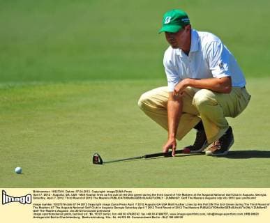 April 7, 2012 - Augusta, GA, USA - Matt Kuchar lines up his putt on the 2nd green during the third round of The Masters at the Augusta National Golf Club in Augusta, Georgia, Saturday, April 7, 2012. Third Round of 2012 The Masters - ZUMAm67