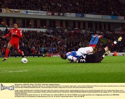 Football - Premier League - Blackburn Rovers vs. Liverpool Alexander Doni of Liverpool takes down Junior Hoilett of Blackburn Rovers to give away a penalty and earn a red card at Ewood Park 