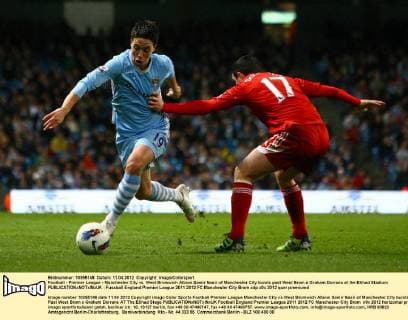 Football - Premier League - Manchester City vs. West Bromwich Albion Samir Nasri of Manchester City bursts past West Brom s Graham Dorrans at the Etihad Stadium 