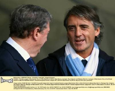 Football - Premier League - Manchester City vs. West Bromwich Albion West Brom s manager, Roy Hodgson and Roberto Mancini, manager of Manchester City at the Etihad Stadium 