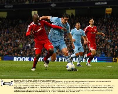 Football - Premier League - Manchester City vs. West Bromwich Albion West Brom s Youssuf Mulumbu battles Gareth Barry of Manchester City at the Etihad Stadium 