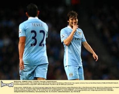 Football - Premier League - Manchester City vs. West Bromwich Albion David Silva of Manchester City signals to Carlos Tevez at the Etihad Stadium 