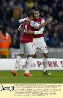 Football - Premier League - Wolverhampton Wanderers vs. Arsenal Arsenal s Theo Walcott celebrates scoring their second goal with Robin van Persie at Molineux Stadium, Wolverhampton 