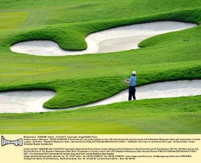 Kuala Lumpur, Malaysia - DAVID GLEESON of Australia hits out of the bunker on the 14th hole during the second round of the Maybank Malaysian Open golf tournament in Kuala Lumpur. Golf 2012 - Maybank Malaysian Open - Second Round - ZUMAz93