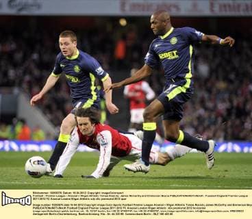 Football - Premier League - Arsenal v Wigan Athletic Tomas Rosicky, James McCarthy and Emmerson Boyce 