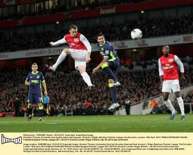 Arsenals Thomas Vermaelen scoring his sides opening goal..Arsenal v Wigan, Barclays Premier League, the Emirates, London. 16th April 2012. EDITORIAL USE ONLY. No use with unauthorised audio, video, data, fixture lists, club league logos or live services. Online in-match use limited to 120 images, no video emulation. No use in betting, games or single club league player publications.