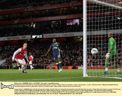 Arsenals Thomas Vermaelen scoring his sides opening goal..Arsenal v Wigan, Barclays Premier League, the Emirates, London. 16th April 2012. EDITORIAL USE ONLY. No use with unauthorised audio, video, data, fixture lists, club league logos or live services. Online in-match use limited to 120 images, no video emulation. No use in betting, games or single club league player publications.