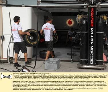 Motorsports: FIA Formula One World Championship 2012, Grand Prix of Bahrain, mechanic of Vodafone McLaren Mercedes with Pirelli tyres xHOCHxZWEIx