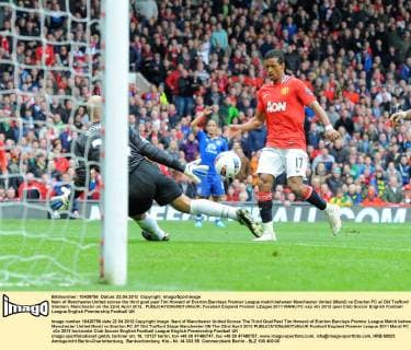 Nani of Manchester United scores the third goal past Tim Howard of Everton.Barclays Premier League match between Manchester United (ManU) vs Everton FC at Old Trafford Stadium, Manchester on the 22nd April 2012. EDITORIAL USE ONLY. No use with unauthorised audio, video, data, fixture lists, club league logos or live services. Online in-match use limited to 120 images, no video emulation. No use in betting, games or single club league player publications.