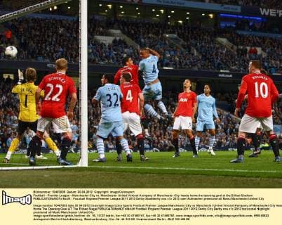 Football - Premier League - Manchester City vs. Manchester United Vincent Kompany of Manchester City heads home the opening goal at the Etihad Stadium 