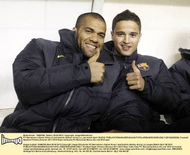FC Barcelona s Daniel Alves (l) and Ibrahim Afellay during La Liga match.April 29,2012.  (20120429239)