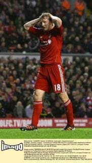 Football - Premier League - Liverpool vs. Fulham Dirk Kuyt of Liverpool looks dejected at Anfield 