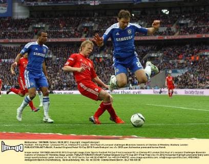 Football - FA Cup Final - Liverpool FC vs. Chelsea FC London; Dirk Kuyt of Liverpool challenges Branislav Ivanovic of Chelsea at Wembley Stadium, London 