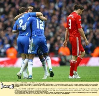 Football - FA Cup Final - Liverpool FC vs. Chelsea FC London; Jose Bosingwa of Chelsea celebrates as Andy Carroll of Liverpool heads off the pitch, looking dejected at Wembley Stadium, London 
