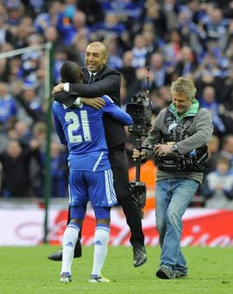 Roberto Di Matteo manager of Chelsea FC runs onto the field to celebrate with Salomon Kalou..The FA Cup with Budweiser final between Chelsea FC London and FC Liverpool at Wembley Stadium, London 5th May 2012 EDITORIAL USE ONLY. No use with unauthorised audio, video, data, fixture lists, club league logos or live services. Online in-match use limited to 120 images, no video emulation. No use in betting, games or single club league player publications.
