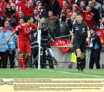 Liverpools Luis Suarez argues with the linesman after Andy Carrolls header was not given as a goal..The FA Cup with Budweiser final between Chelsea FC London and Liverpool FC at Wembley Stadium, London 5th May 2012. EDITORIAL USE ONLY. No use with unauthorised audio, video, data, fixture lists, club league logos or live services. Online in-match use limited to 120 images, no video emulation. No use in betting, games or single club league player publications.