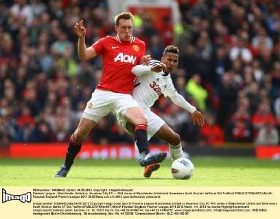 Premier League - Manchester United vs. Swansea City FC -- Phil Jones of Manchester United and Swansea s Scott Sinclair battle at Old Trafford 