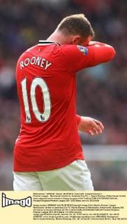Premier League - Manchester United vs. Swansea City FC -- Wayne Rooney of Manchester United looks dejected as he misses a chance on goal at Old Trafford 