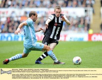 Premier League - Newcastle United vs. Manchester City -- Pablo Zabaleta (Manchester City) about to bring down Shane Ferguson (Newcastle United) at St James Park. 