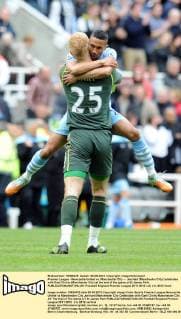 Premier League - Newcastle United vs. Manchester City -- Joe Hart (Manchester City) celebrates with Gael Clichy (Manchester City) at the end of the game at St James Park. 