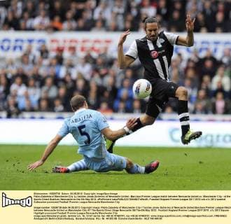 Pablo Zabaleta of Manchester City (L) tackles Jonas Gutierrez of Newcastle United - Barclays Premier League match between Newcastle United vs. Manchester City - at the Sports Direct Stadium, Newcastle on the 6th May 2012. xPicRichard LeexEDITORIAL USE ONLY. No use with unauthorised audio, video, data, fixture lists, club league logos or live services. Online in-match use limited to 120 images, no video emulation. No use in betting, games or single club league player publications.