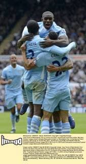 Yaya Toure of Manchester City (L) scores his side s second goal with team mates- Barclays Premier League match between Newcastle United vs. Manchester City - at the Sports Direct Stadium, Newcastle on the 6th May 2012. xPicRichard LeexEDITORIAL USE ONLY. No use with unauthorised audio, video, data, fixture lists, club league logos or live services. Online in-match use limited to 120 images, no video emulation. No use in betting, games or single club league player publications.